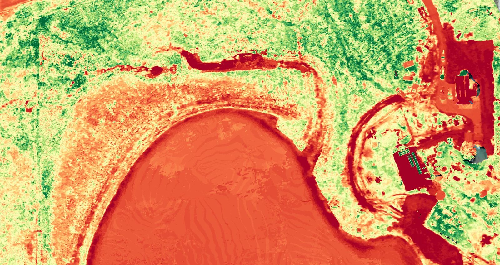 Plant health map of the same area at Stoney Creek Farm, showing the dam, paddocks, tracks and buildings in red, orange, yellow and green, Skyhawk Aerial drone imagery